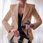 Trendy women's blazers with velvet gold buttons.